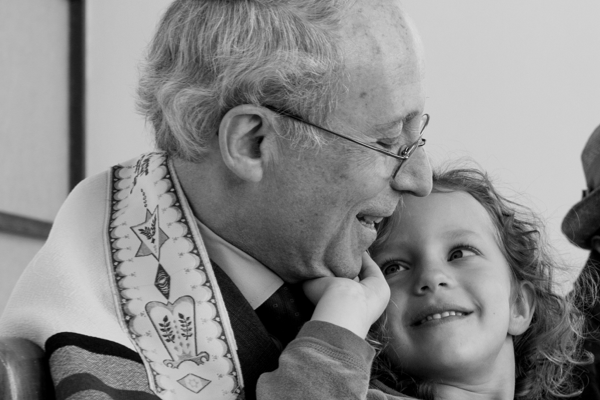 Grandfather and child in synagogue
